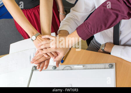 Teamwork for a success. Team support at the office Stock Photo