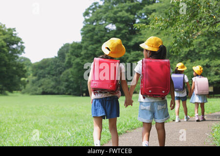 Japanese kid in a city park Stock Photo
