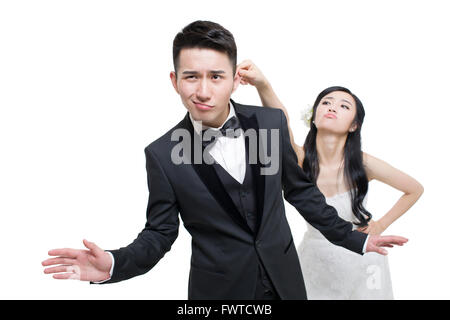 Bride pulling groom's ear Stock Photo