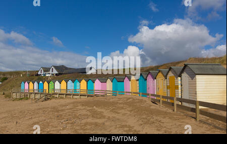 Bude North Cornwall England uk with colourful pastel beach huts on the beach on a beautiful day Stock Photo
