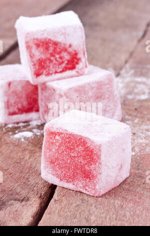 Turkish delight on a wooden background Stock Photo