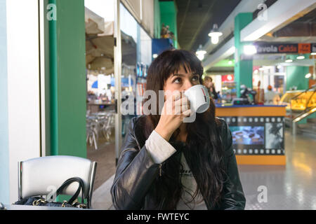 Roma, Italy - October 25, 2015: A nice girl drinking a cappuccino in a Italian bar Stock Photo