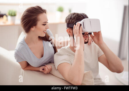 Nice couple using virtual reality device Stock Photo