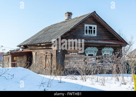 Abandoned rural wooden house with boarded up windows in Russia Stock Photo