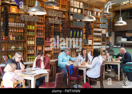 People sitting at table eating in a Bills Restaurant, Reading Berkshire UK Stock Photo