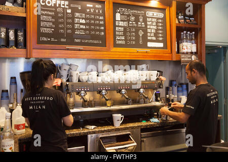 Caffe Nero Baristas making coffee in Caffe Nero coffee shop, Reading, Berkshire UK Stock Photo