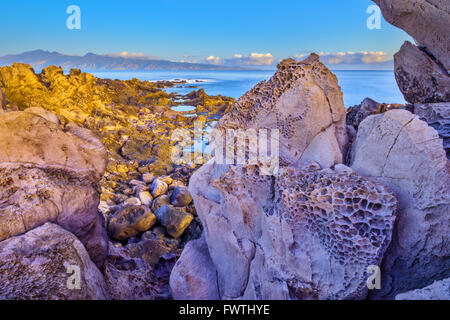 View of Molokai at sunrise from Kapalua area of Maui Stock Photo