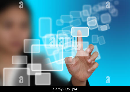 woman hand push on technology virtual touch screen interface (selective focus at finger) Stock Photo