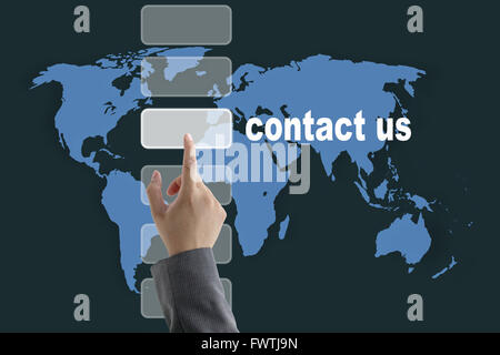 male business hand pushing on contact us button with world map background Stock Photo