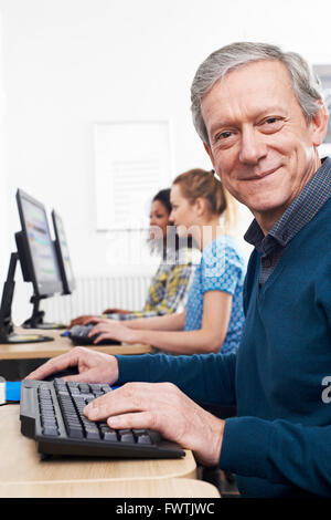 Mature Man Attending Computer Class Stock Photo