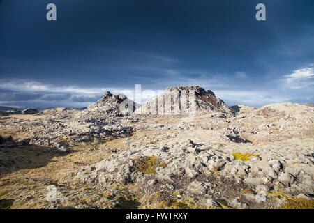 Ominous sky over an unearthly lava landscape near the Hekla volcano in Iceland Stock Photo