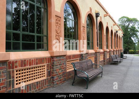 Empty benches near Conservatory in Fitzroy Gardens Melbourne Victoria Australia Stock Photo