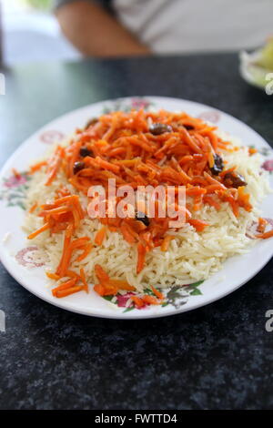 Exotic Afghan cuisine, rice with carrot and raisins Stock Photo