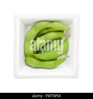 Edamame beans in a square bowl isolated on white background Stock Photo