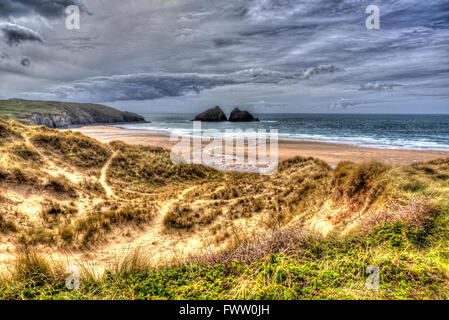 Holywell Bay North Cornwall coast England UK near Newquay and Crantock with Carters Rocks in colourful hdr Stock Photo