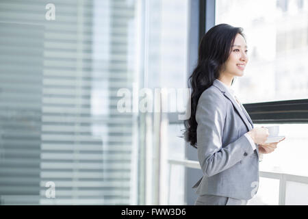 Businesswoman taking a coffee break Stock Photo