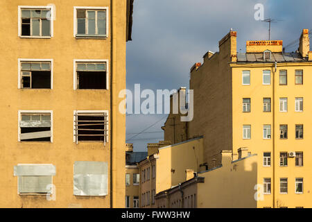 Composition of different facades of apartment buildings on the background of cloudy sky Stock Photo