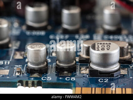 Capacitor on printed computer circuit board, closeup Stock Photo
