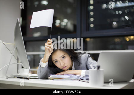 Businesswoman working late in office Stock Photo