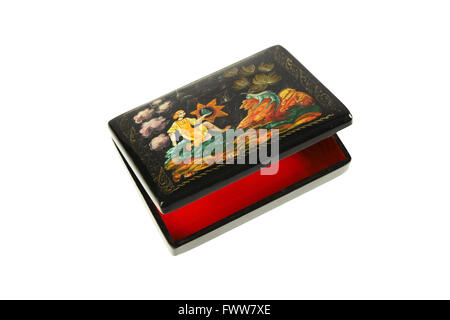 Black wooden lacquered casket with painting on lid. The theme of painting old russian fairy tales. Cover slightly open.  Inside  Stock Photo