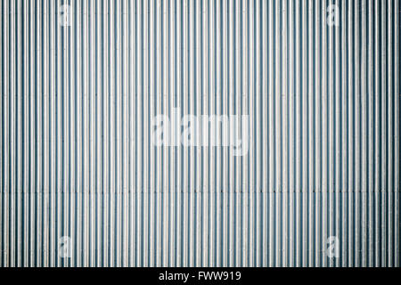 Vintage toned corrugated metal roof, picture taken from above, industrial background or texture. Stock Photo