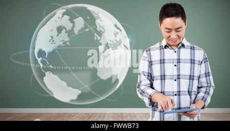 Composite image of cheerful man using tablet computer Stock Photo