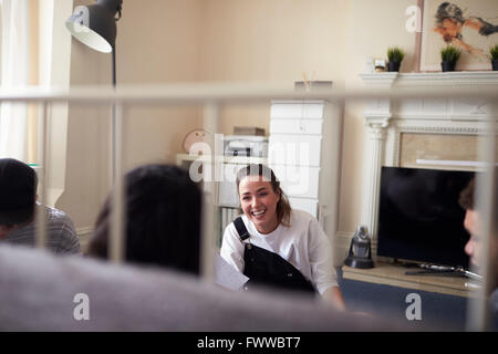 Group Of Students Hanging Out In Shared House Together Stock Photo