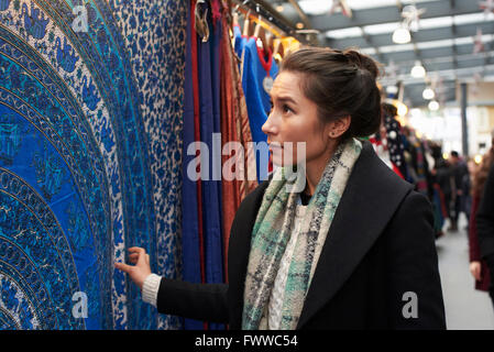 Young Woman Shopping In Covered Market