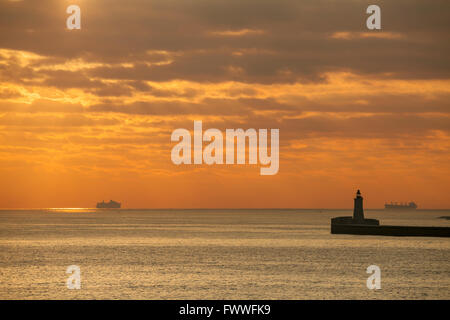 Sunrise off the coast of Malta. Entrance to Grand Harbour. Stock Photo