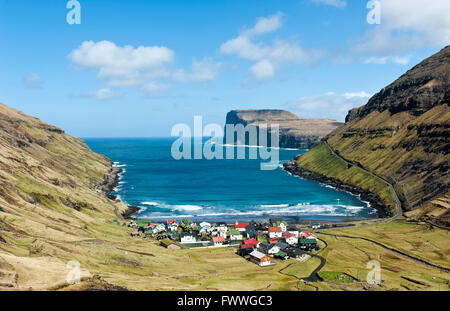 Overlooking Tjørnuvík or Tjornuvik, Streymoy, behind spiers Risin og Kellingin in front of cliff Eiðiskollur, Faroe Islands Stock Photo