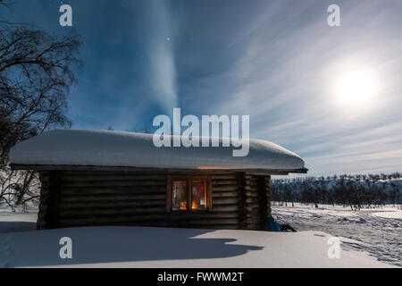 Ruktajärvi open wilderness hut in the moonlight.