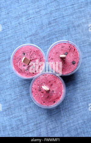 Blackcurrant popsicles in plastic cups, top view Stock Photo