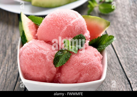 Watermelon sorbet ice cream in bowl, close up view Stock Photo