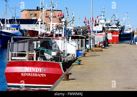 Simrishamn, Sweden - April 1, 2016: Moored boats in the Simrishamn fishing harbor on a fine spring day. Stock Photo
