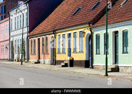 Simrishamn, Sweden - April 1, 2016: An empty street in town. Buildings are painted in soft pastel like colors, giving them a cer Stock Photo