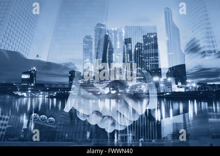 handshake double exposure, business deal and collaboration concept, modern city skyline Stock Photo