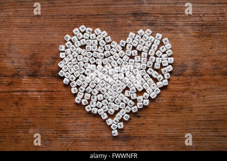 heart from letters on wooden background, love learning, education and literacy concept Stock Photo