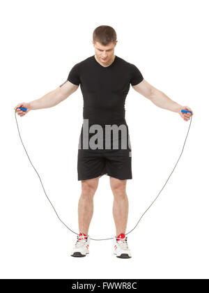 Young male jumping with jumping rope isolated at white background Stock Photo