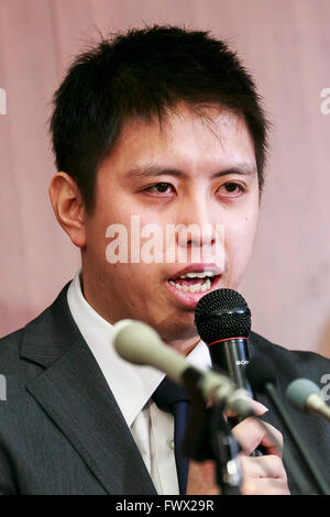 Japanese badminton player Kenichi Tago speaks during a news conference on April 8, 2016, Tokyo, Japan. An NTT East badminton team representative, Masayuki Okumoto, said that Keinichi Tago had lost approximately 10 million yen through gambling and had visited an illegal casino 60 times. He also said that world number 2, Kento Momota had lost 500,000 yen. Gambling is illegal in Japan and can carry a prison sentence and both the badminton stars admitted visiting a yakuza operated casino. Momota and Tago were expected to represent Japan in the Rio Olympic Games with Momota a medal favorite. The tw Stock Photo