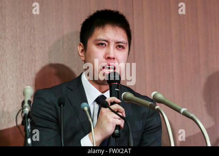 Japanese badminton player Kenichi Tago speaks during a news conference on April 8, 2016, Tokyo, Japan. An NTT East badminton team representative, Masayuki Okumoto, said that Keinichi Tago had lost approximately 10 million yen through gambling and had visited an illegal casino 60 times. He also said that world number 2, Kento Momota had lost 500,000 yen. Gambling is illegal in Japan and can carry a prison sentence and both the badminton stars admitted visiting a yakuza operated casino. Momota and Tago were expected to represent Japan in the Rio Olympic Games with Momota a medal favorite. The tw Stock Photo