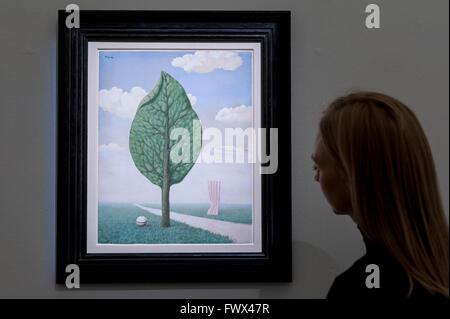 London, UK.  8 April 2016.  A Sotheby's staff member views René Magritte's 'La Geante', 1936, est. $1.4-1.8million.  Sotheby's auction preview, at their New Bond Street gallery, of works to be in the upcoming New York Impressionist, modern and contemporary art sale.  Credit:  Stephen Chung / Alamy Live News Stock Photo