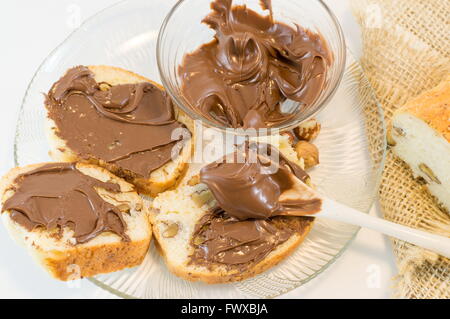 Chocolate cream on a homemade walnut bread slices Stock Photo