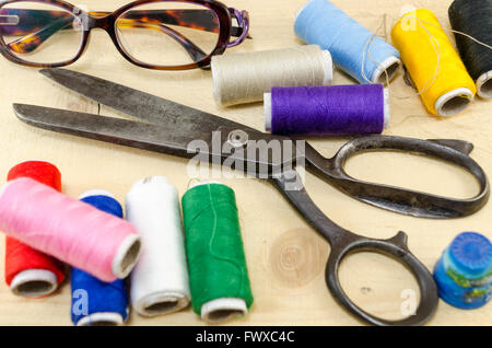 Sewing equipment chaos scattered on the table Stock Photo