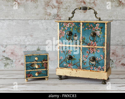 Beautiful handmade decoupaged jewellery boxes on a rustic background Stock Photo