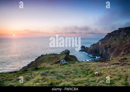 Stunning sunset over the Crown Mines engine houses perched on cliffs at Botallack near Land's End in Cornwall Stock Photo
