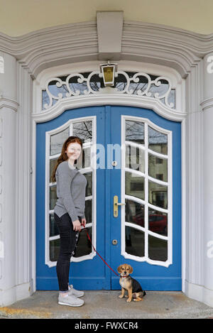 portrait of a young woman with her small dog Stock Photo