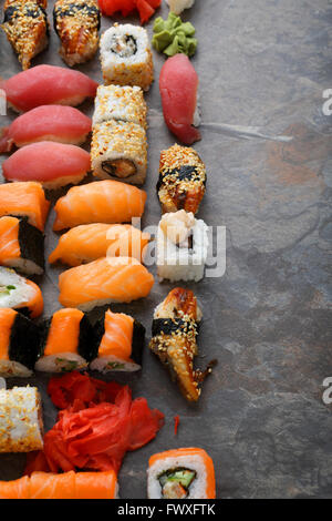 sushi and rolls set on slate, food