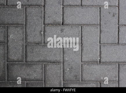 Paved walkway made from concrete blocks usable as background or texture. Stock Photo