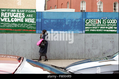 Pro-refugees and anti-Capitalism signs in Dalston, London Stock Photo