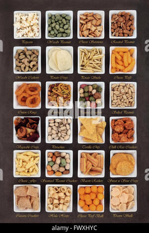 Large savory snack food selection in square porcelain bowls with titles Stock Photo